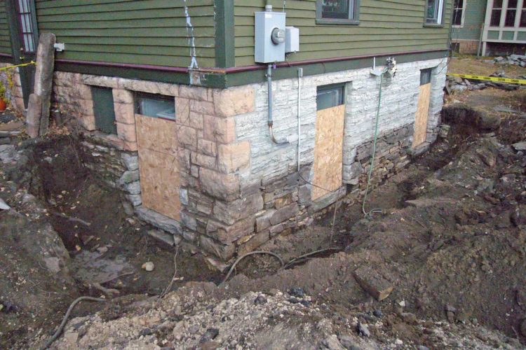 Fully restored stone foundation with reinforced mortar and corrected wall alignment.