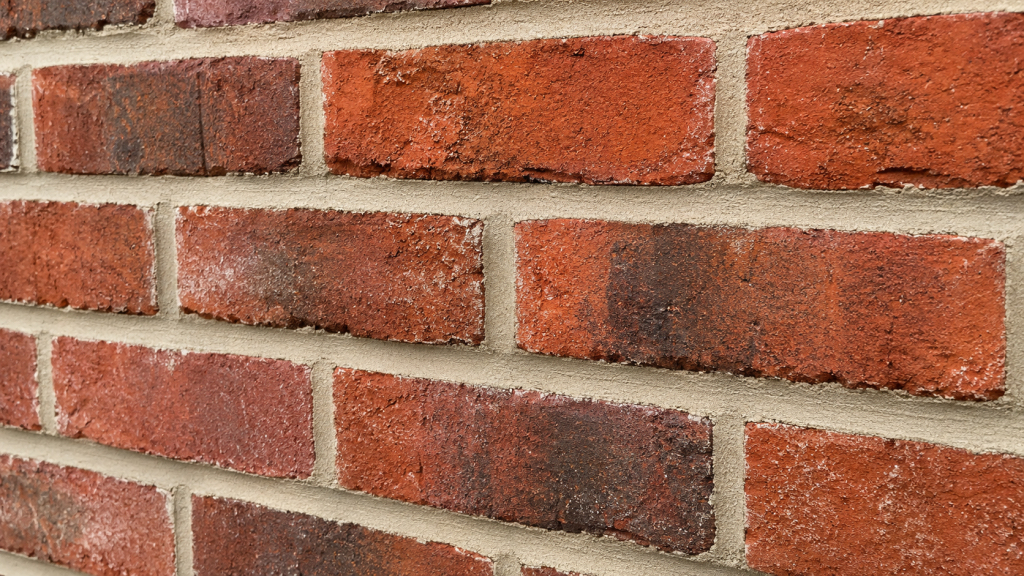Close-up of brick wall showing repointed mortar joints on a Cincinnati home
